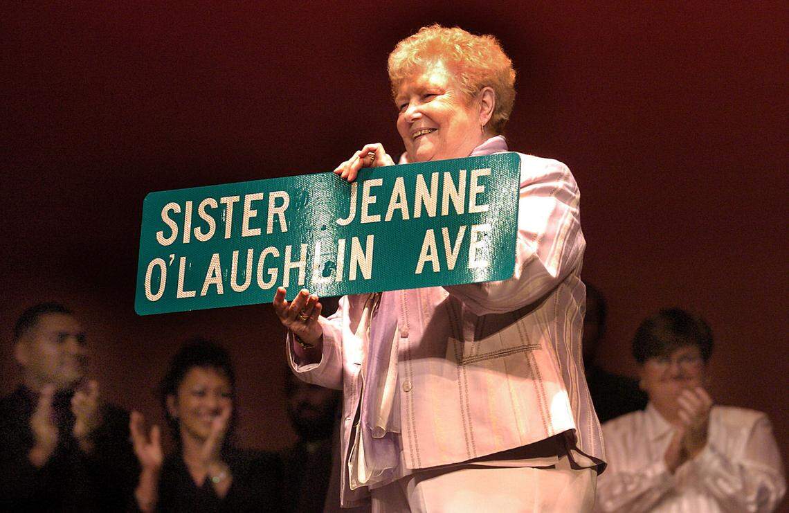 Sister Jeanne O’Laughlin, Barry University’s president, retired June 30, 2004, after more than two decades at Barry University. She was honored with Sister Jeanne O’Laughlin Day/The Barry’s Award Spectacular. A crowd of more than 800 attended the Academy Award-style event. Pictured here in this April 28, 2004, file photo, Sister Jeanne shows off a street sign presented to her from the mayor of Miami Shores.