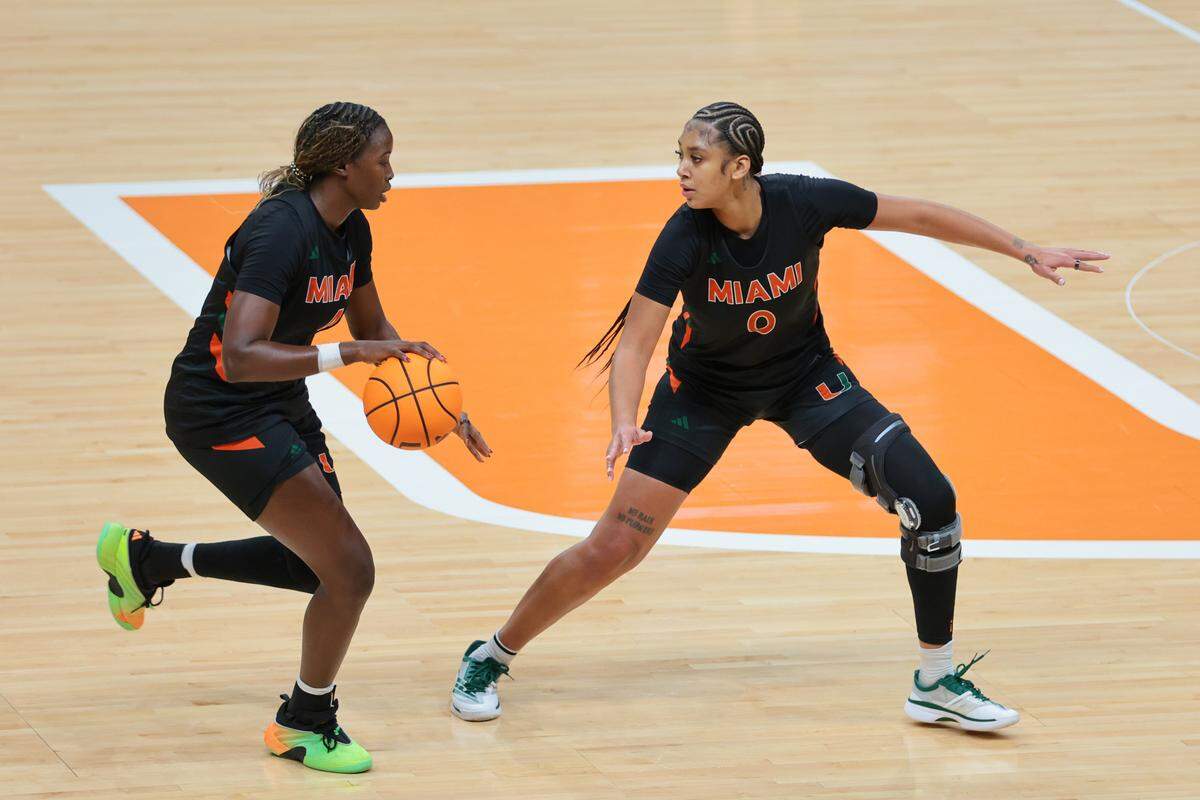 Miami Hurricanes center Ra Shaya Kyle (0) defends against center Candace Kpetikou (4) during practice at the Watsco Center in Coral Gables, Florida, Tuesday, October 28, 2025.