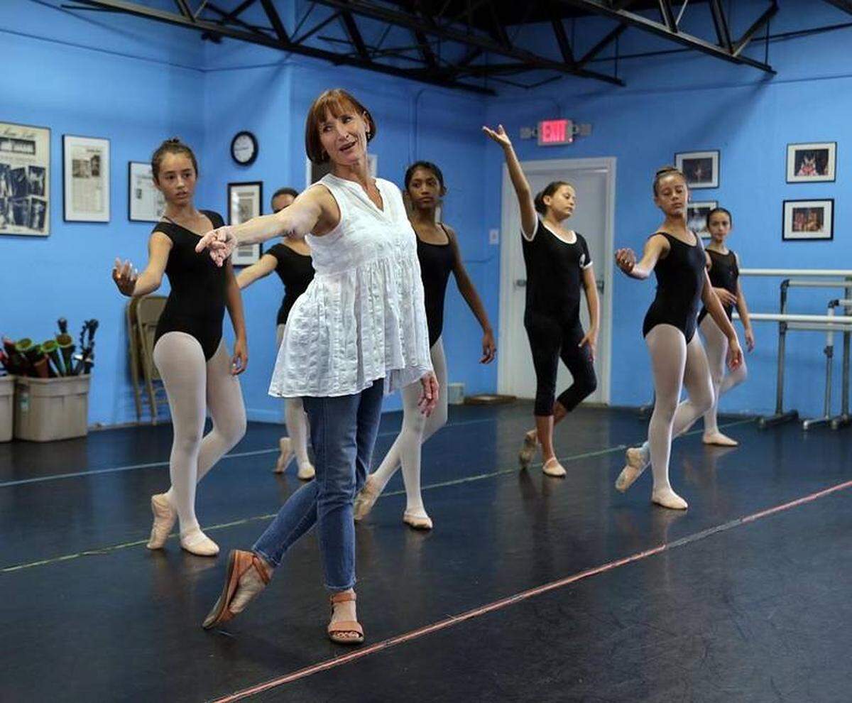 Pre-pandemic, executive artistic director Ruth Wiesen rehearses with dancers from the Thomas Armour Youth Ballet.