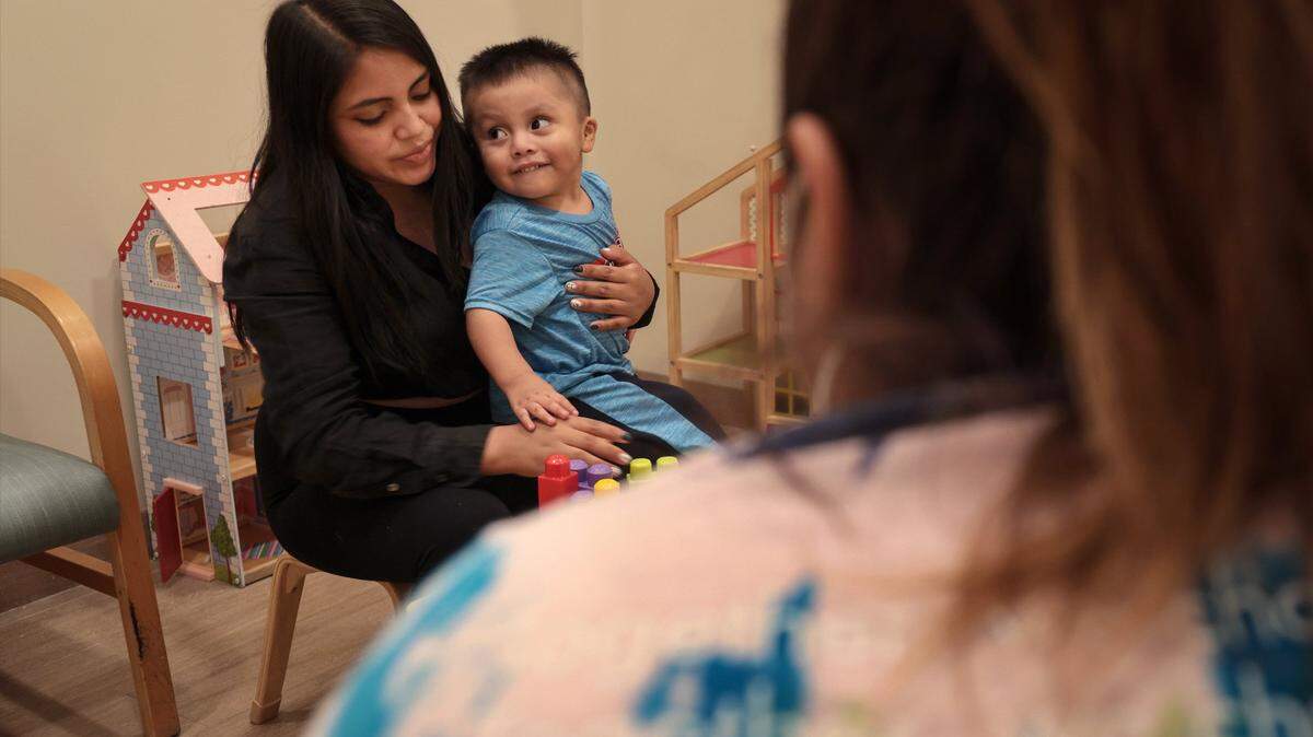 Darwin Lopez, 2, with his mother, Teresa Lopez, 19, at Lotus Village in 2022.