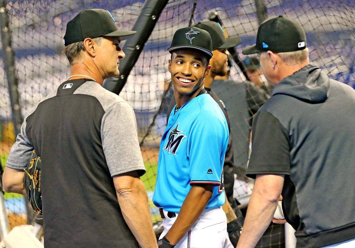 Miami Marlins second round draft pick Nasim Nunez talks with the coaches including manger Don Mattingly before they play the St. Louis Cardinals at Marlins Park in Miami, Florida, Monday, June, 10, 2019.
