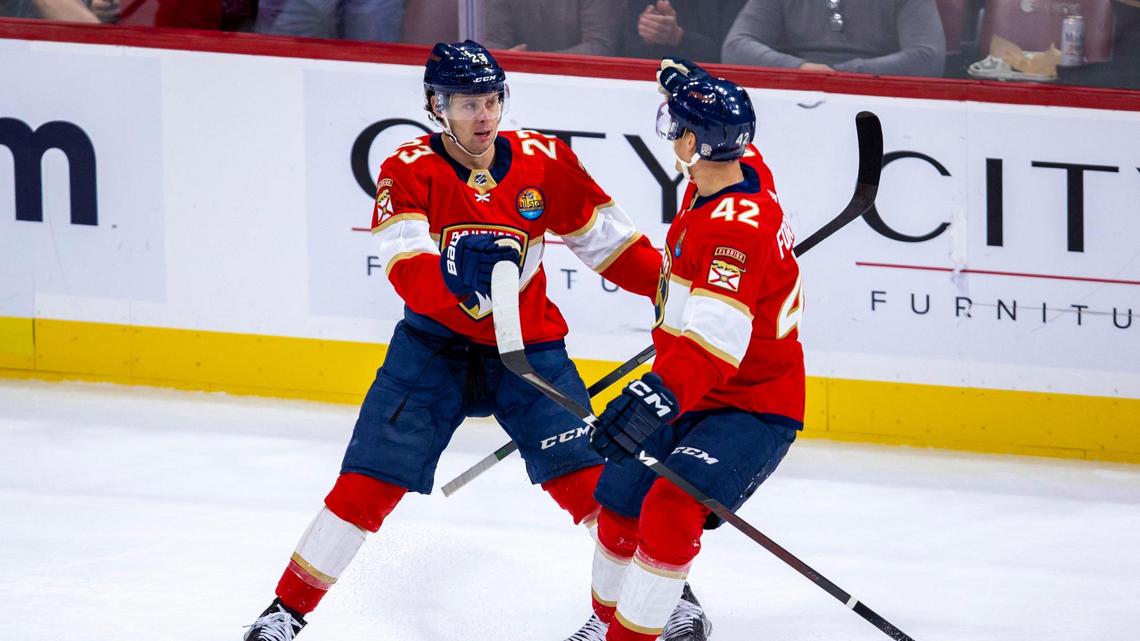 Florida Panthers center Carter Verhaeghe (23) reacts with teammate Gustav Forsling (42) after scoring on the Philadelphia Flyers during the first period of an NHL game at FLA Live Arena in Sunrise, Florida, on Wednesday, October 19, 2022.