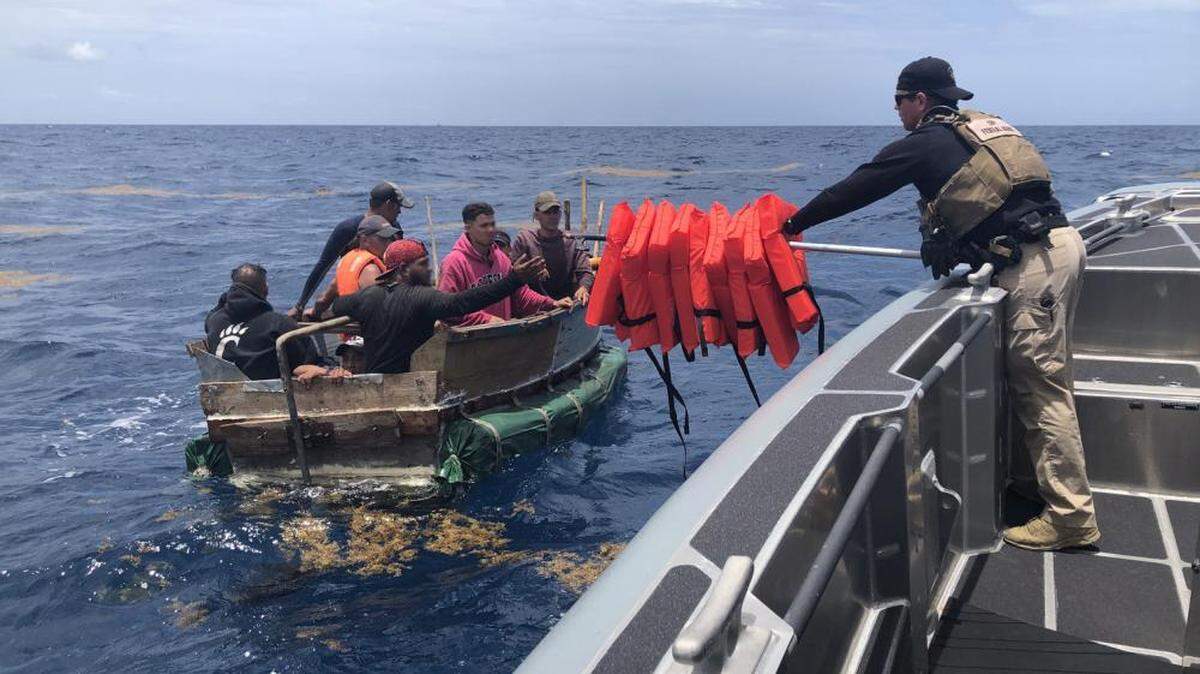 A Customs and Border Protection Air and Marine Operations boat crew rescued people from a rustic vessel taking on water about eight miles south of Key West, Florida, after a civilian notified Sector Key West watchstanders of their distress, Monday, May 30, 2022. The people were repatriated to Cuba on June 2.