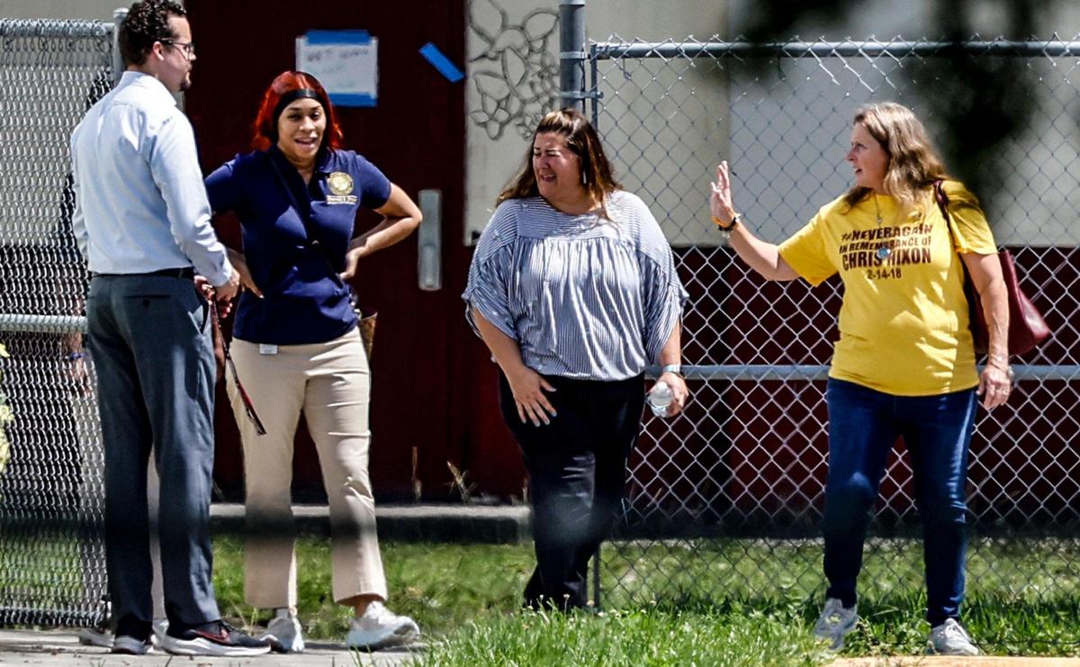 Debra Hixon, at right, wife of Chris Hixon who died in the shooting, departs after visiting the 1200 building of Marjory Stoneman Douglas High School on Thursday, July 6, 2023. The Broward County school district plans to demolish the building where 17 people were murdered on Valentine’s Day in 2018.