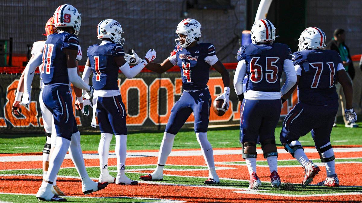 Chaminade-Madonna Lions wide receivers Jeremiah Smith (4) and Joshisa Trader (1) celebrate Smith’s touchdown reception against the Clearwater Central Catholic Marauders in the first quarter during the Class 1M, Region 3, District 6, State Championship game at Bragg Memorial Stadium in Tallahassee, Florida, on Thursday, December 7, 2023.