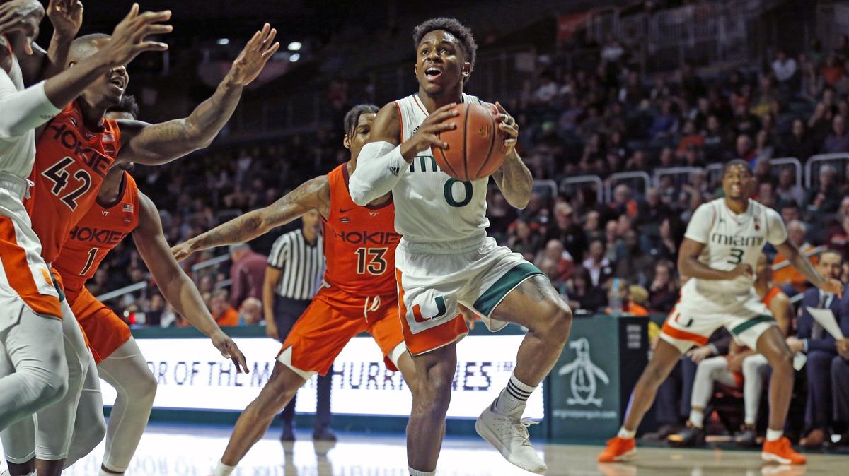 Miami (Fl) Hurricanes guard Chris Lykes (0) looks to shoot under the basket in the first half as the University of Miami hosts Virginia Tech in basketball at Watsco Center on Wednesday, January 30, 2019.