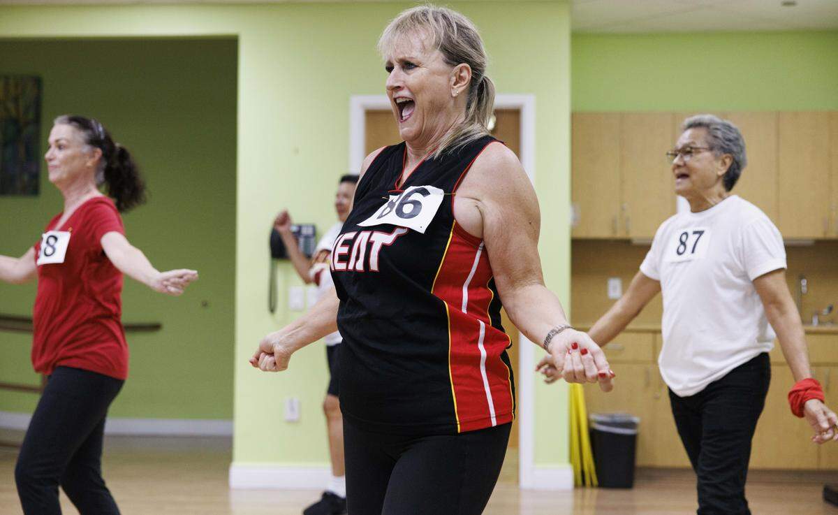 Lori Duffy, center, and Cliff Lui, right, and other participants dance during the Heat Golden Oldies auditions for the Miami Heat senior dance team on Thursday, Sept. 25, 2025, at Southwest Focal Point Community Center in Pembroke Pines, Fla.
