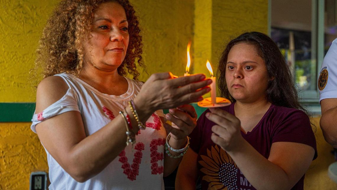 Honduran-Americans Ana Santos (left) and Angie Carballo attended a vigil in Doral in May in support of extending Temporary Protected Status for Venezuelans.
