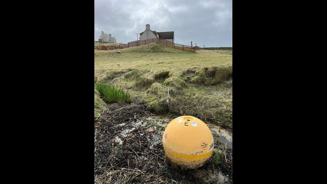 Mary Ann Macintyre snapped these photos of the buoy after it washed up on the Isle of Eriskay in Scotland, NOAA says.