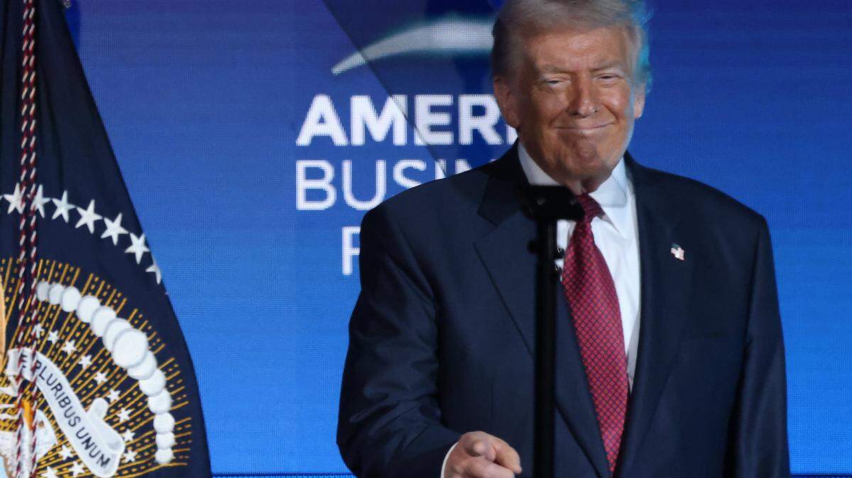 President Donald J. Trump smiles after walking on stage to address the attendees of the American Business Forum at the Kaseya Center in Miami, Florida on Wednesday, November 5, 2025.