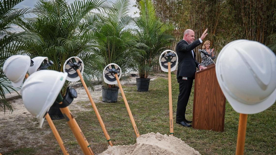 In 2022, Roy Coley, director of the Miami-Dade Water and Sewer Department, center, greets attendees for the groundbreaking of the Connect 2 Project in Miami Shores, a multi-year, countywide program that provides sanitary sewer service to residents with septic tank systems. . 