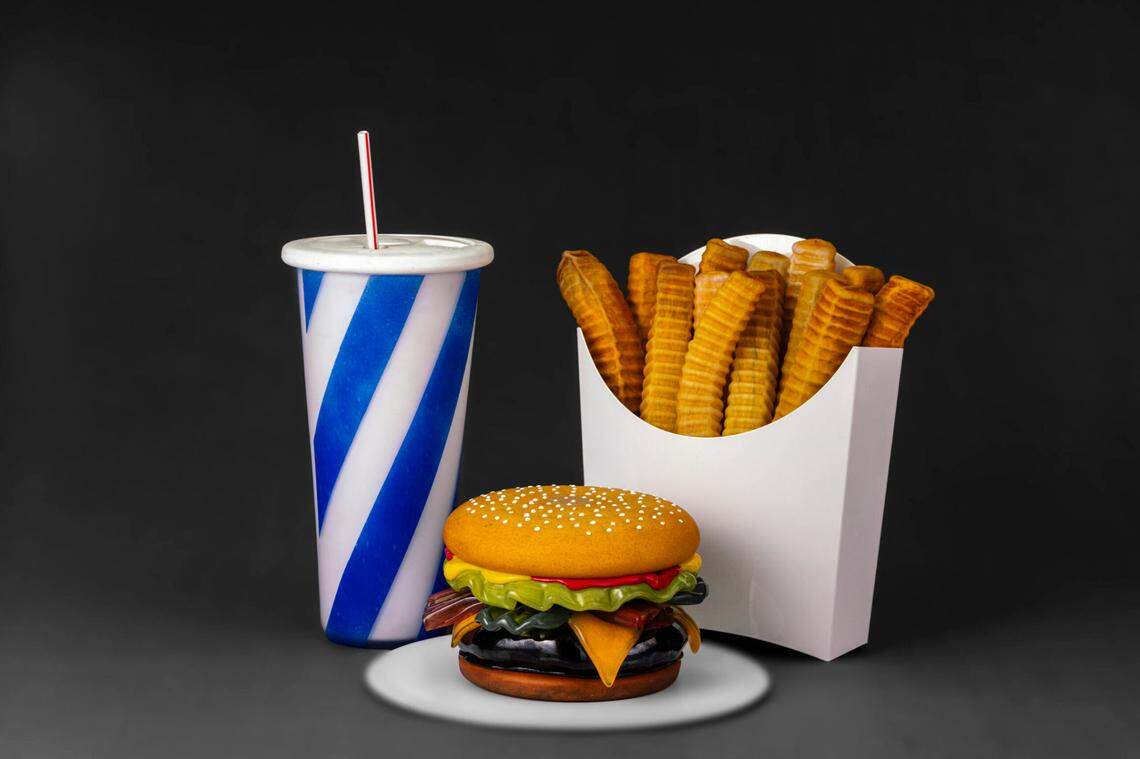 “Order Up! The Pop Art of John Miller” at the Lowe Art Museum features burgers, fries and diner settings blown in glass. 