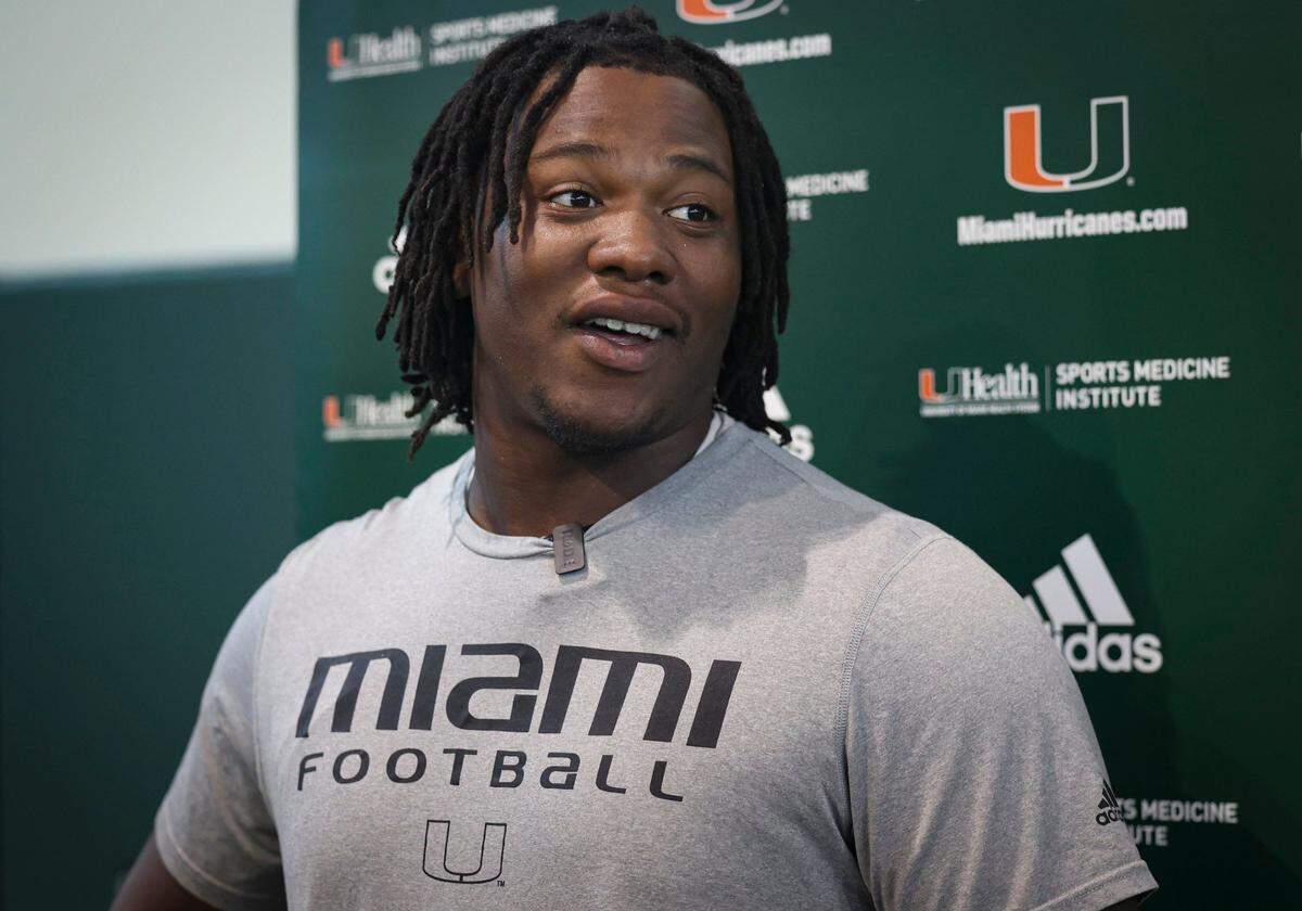 Hurricanes defensive lineman Branson Deen (58) talks to the press after the University of Miami Hurricanes football practice on Tuesday, March 21, 2023, on campus in Coral Gables. Deen transferred from Purdue in January.