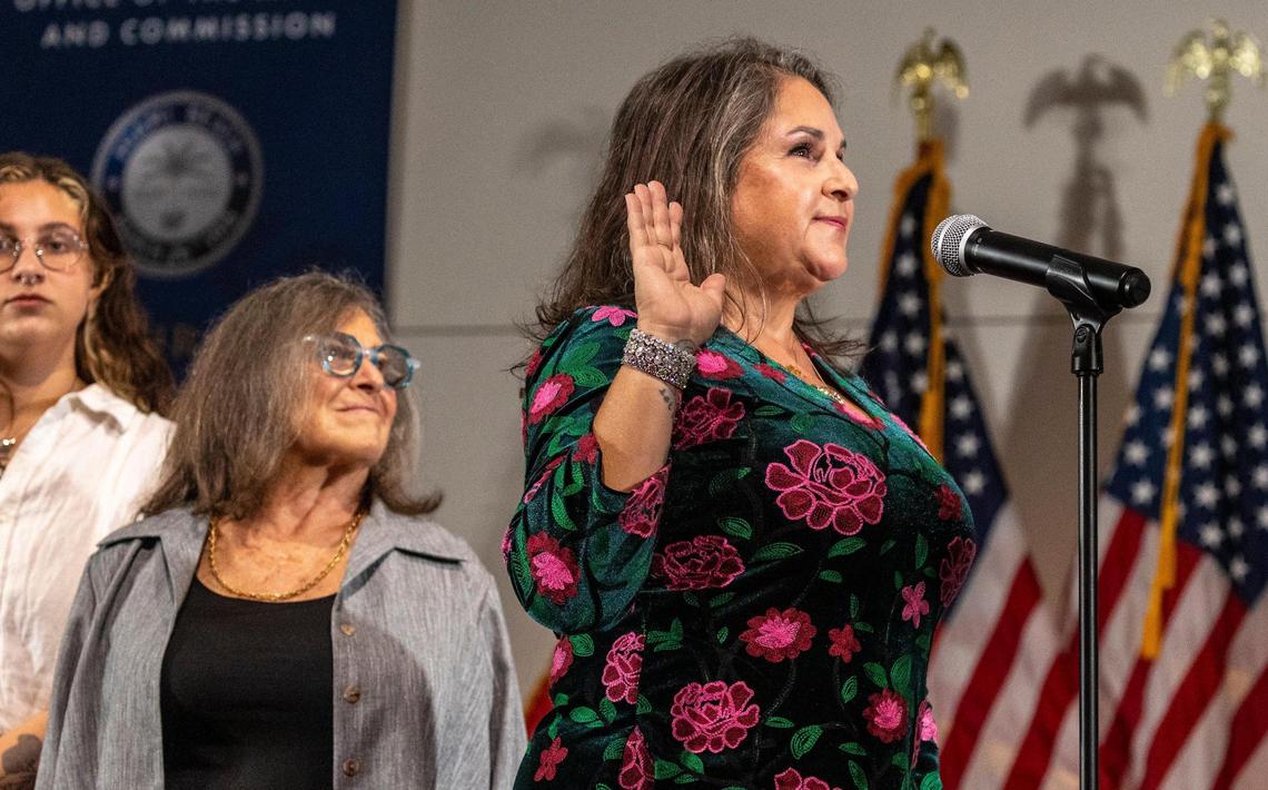 Miami Beach Commissioner Tanya Bhatt raises her right hand as she is sworn in during a ceremony at the Miami Beach Convention Center, Tuesday, November 28, 2023.