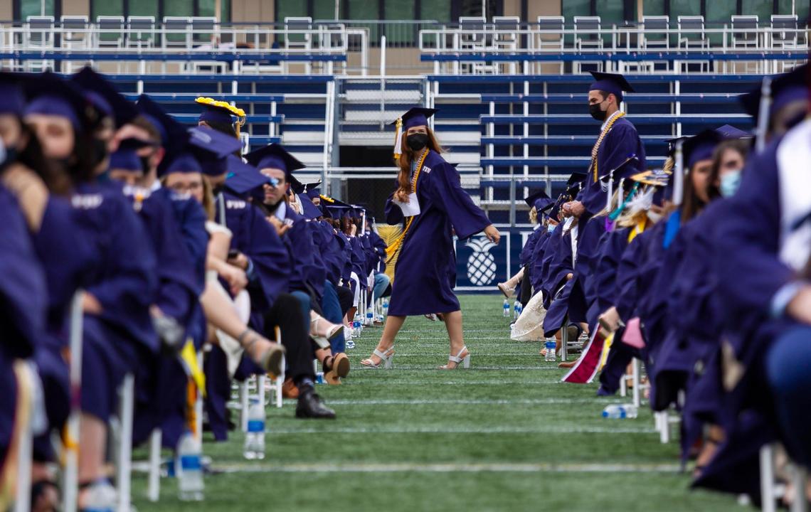 Florida International University students participate in their graduation ceremony inside the Riccardo Silva Stadium in Miami, Florida on Saturday, April 24, 2021.
