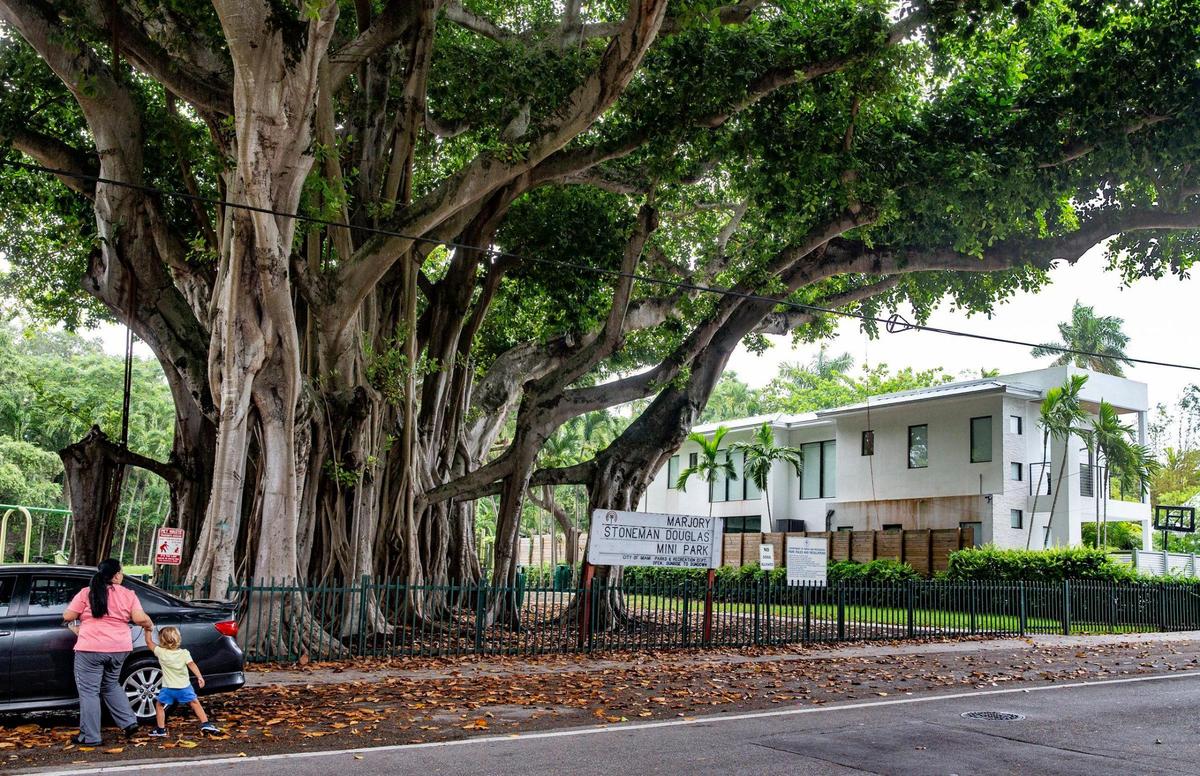 A large, stark white modern-style home sits next to Marjory Stoneman Douglas Mini Park at 2901 SW 22nd Ave., in Coconut Grove.
