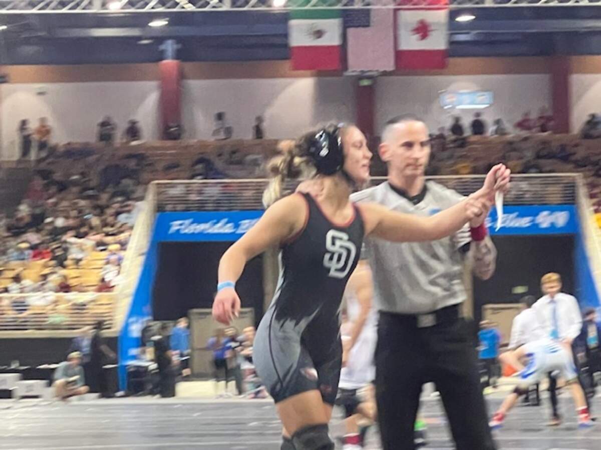 Stoneman Douglas’ Gabriela Caro celebrates after beating Florida Christian’s Rachel Silva in the girls’ 130-pound weight class state championship bout on Saturday in Kissimmee, Fla.