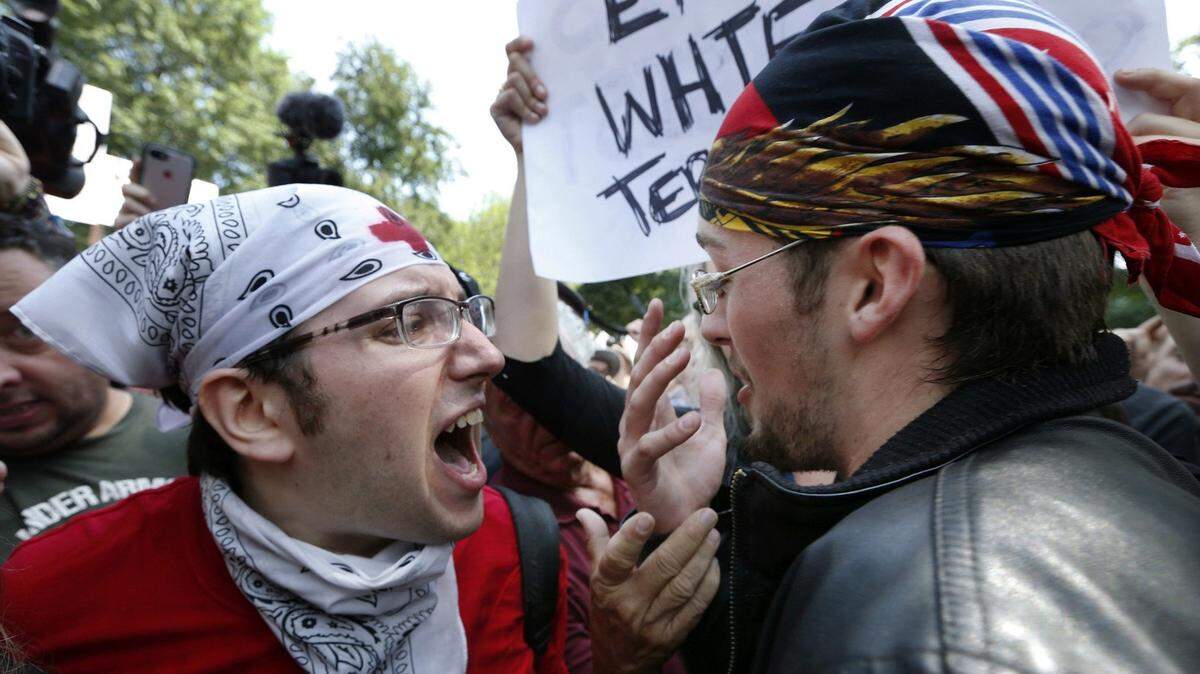 A counterprotester, left, confronts a professed supporter of President Trump at a “Free Speech” rally by conservative activists in Boston in 2017.