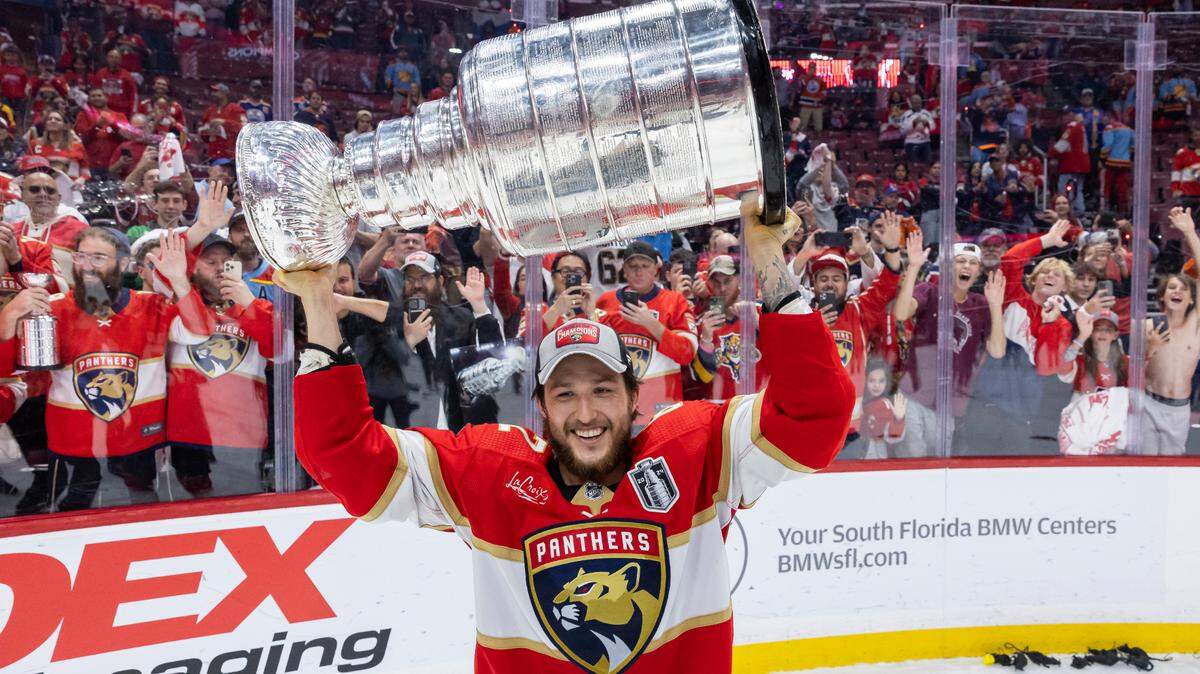 Florida Panthers defenseman Brandon Montour (62) lifts the Stanley Cup after defeating the Edmonton Oilers in Game 7 of the Stanley Cup Final at Amerant Bank Arena on Monday, June 24, 2024, in Sunrise, Fla.