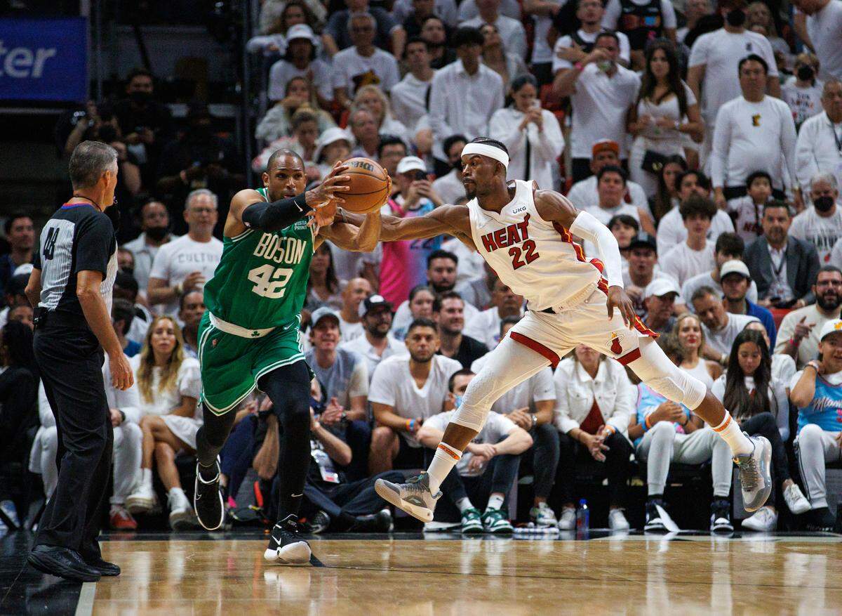 Miami Heat forward Jimmy Butler (22) defends Boston Celtics center Al Horford (42) during the third quarter of Game 7 of the NBA Eastern Conference Finals series at FTX Arena in Miami, Florida, on Sunday, May 29, 2022.