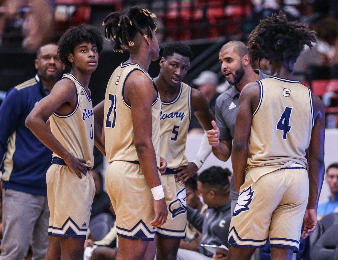 Calvary Christian Academy head coach Cilk McSweeney talks to players during a time out in the game against Andrew Jackson in the Florida High School Athletic Association Class 4A boys basketball state championship at the RP Funding Center in Lakeland on Saturday, March 5, 2022.