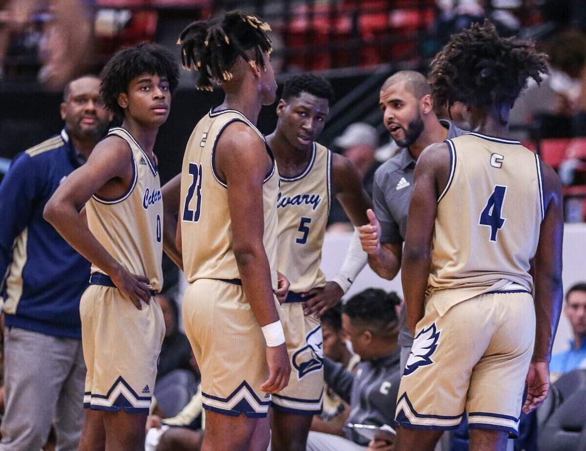 Calvary Christian Academy head coach Cilk McSweeney talks to players during a time out in the game against Andrew Jackson in the Florida High School Athletic Association Class 4A boys basketball state championship at the RP Funding Center in Lakeland on Saturday, March 5, 2022.