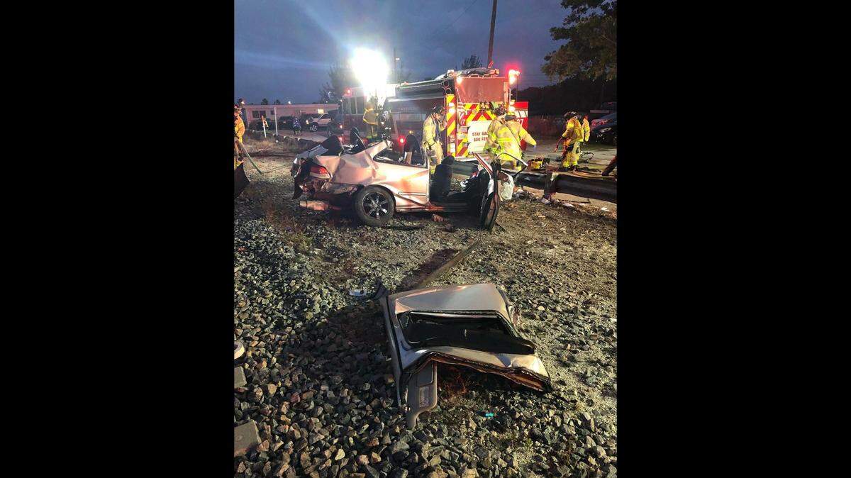 The remains of a car that cut around a gate arm and was hit by a Brightline train Wednesday morning.
