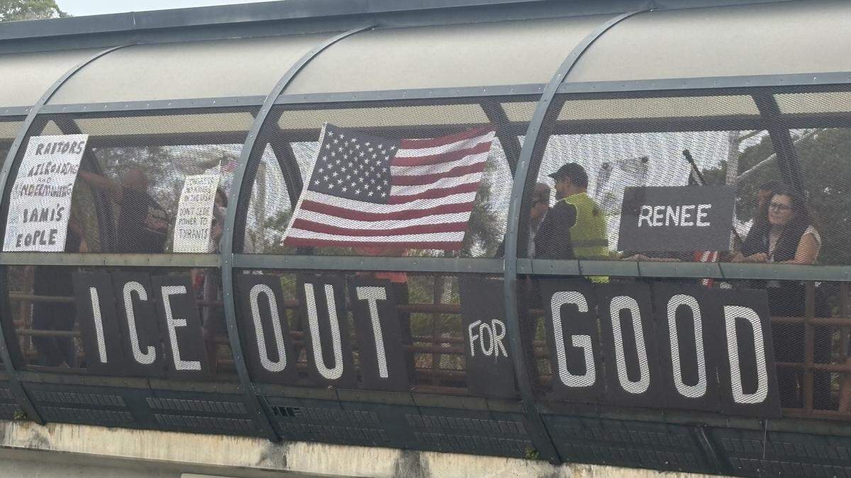 Protesters stand on the Vizcaya pedestrian bridge across U.S. 1 in Miami Monday, Jan. 12, 2026, to demonstrate against U.S. Immigration and Customs Enforcement and the Trump administration. The sign for Renee refers to Renee Good, the 37-year-old mother of three shot and killed by an ICE agent in Minneapolis on Wednesday morning, Jan. 7, 2026.