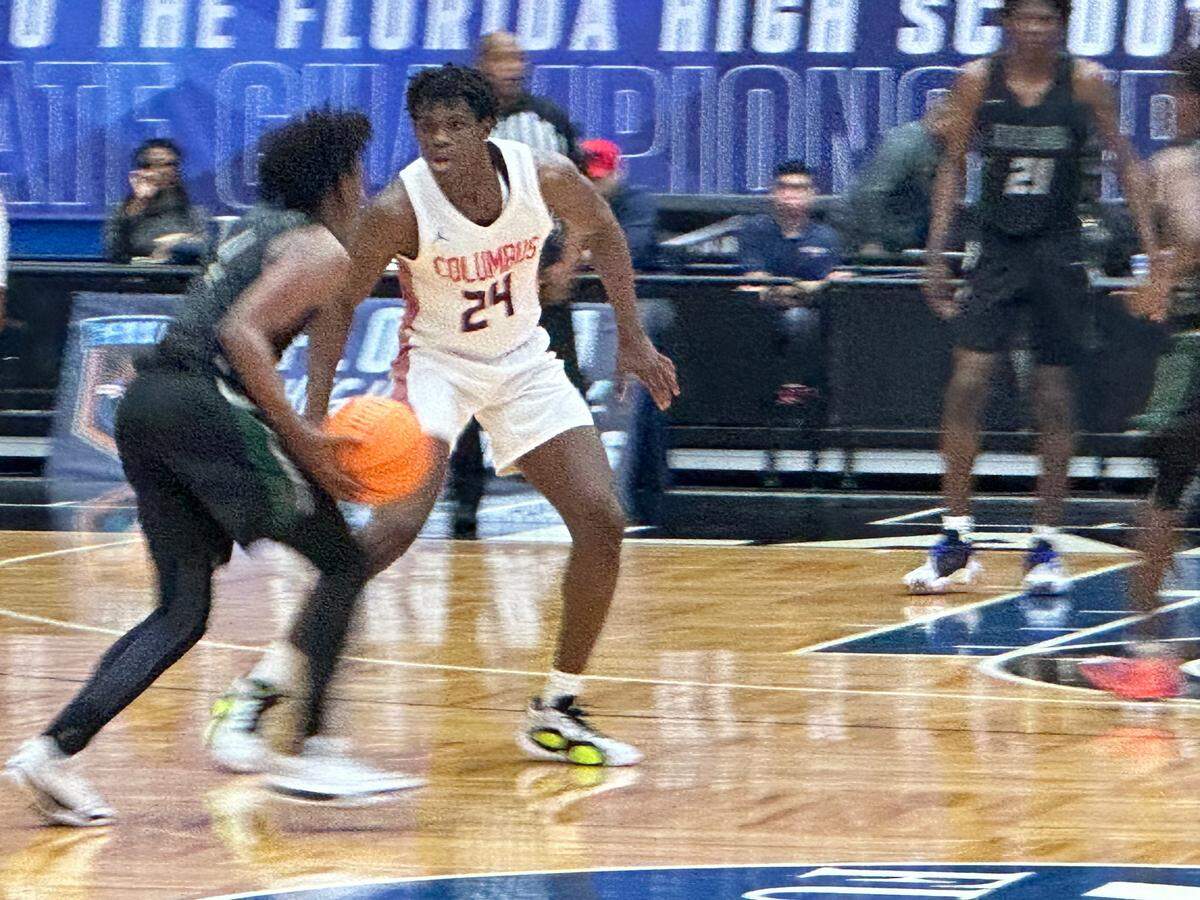 Columbus guard Malik Abdullahi guards near the perimeter during Friday’s victory over Orlando Evans in a Class 7A state semifinal at the RP Funding Center in Lakeland, Fla.