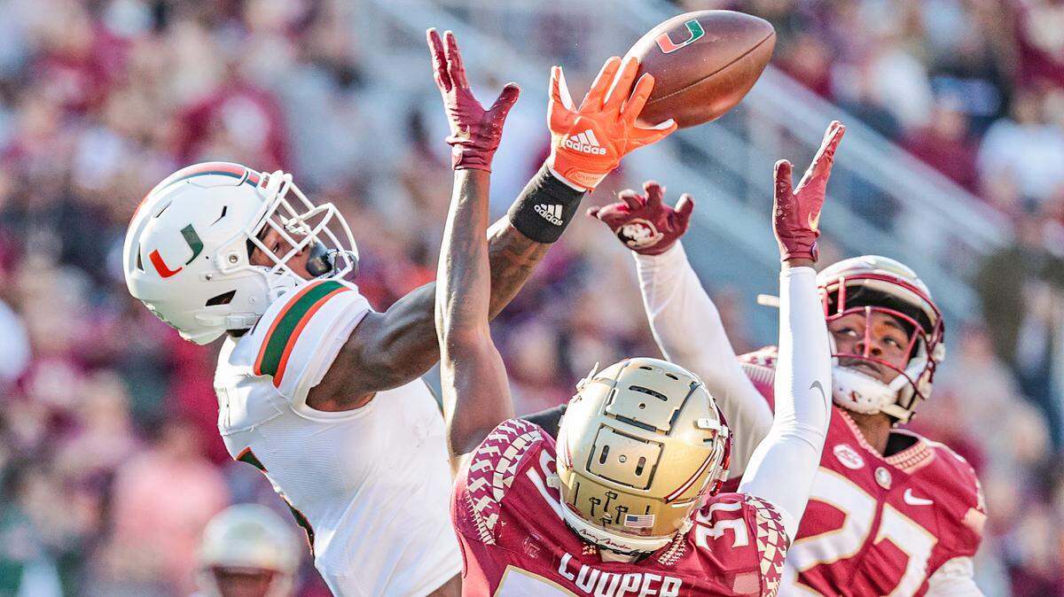 Florida State Seminoles defensive back Omarion Cooper and Hurricanes receiver Key’Shawn Smith battle for the ball in the first quarter at Doak Campbell Stadium in Tallahassee on Saturday, November 13, 2021. Both players are back for the annual rivalry on Saturday at Hard Rock Stadium.