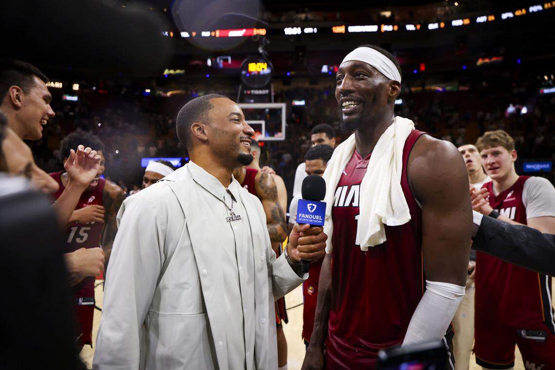 Miami Heat center Bam Adebayo (13) is interviewed by teammate Norman Powell (24) after Adebayo scored 83 points against the Washington Wizards, marking the second-highest single-game point total in NBA history, on Tuesday, March 10, 2026, at Kaseya Center in downtown Miami, Fla. The Miami Heat won 150-129.