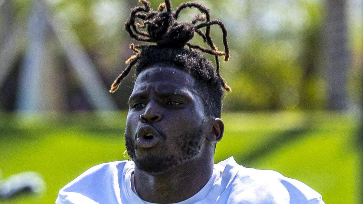 Miami Dolphins wide receiver Tyreek Hill (10) jogs across the field during the first day of mandatory mini camp at Baptist Health Training Complex in Miami Gardens, Florida, on Wednesday, June 1, 2022.
