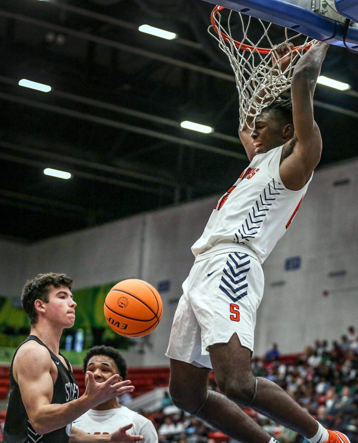 Stranahan forward Hykeem Williams (12) dunks the ball during game against St. Petersburg in the Florida High School Athletic Association Class 5A boys basketball state championship at the RP Funding Center in Lakeland on Saturday, March 5, 2022.