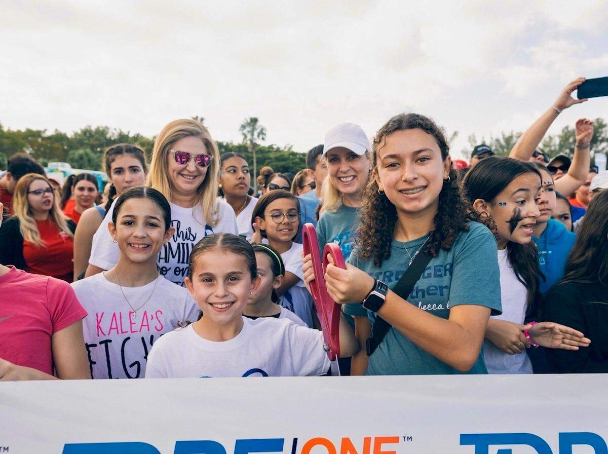 Advocates and patients gather at the ribbon cutting ceremony for the Breakthrough T1D Walk held in February at Tropical Park Miami. 
