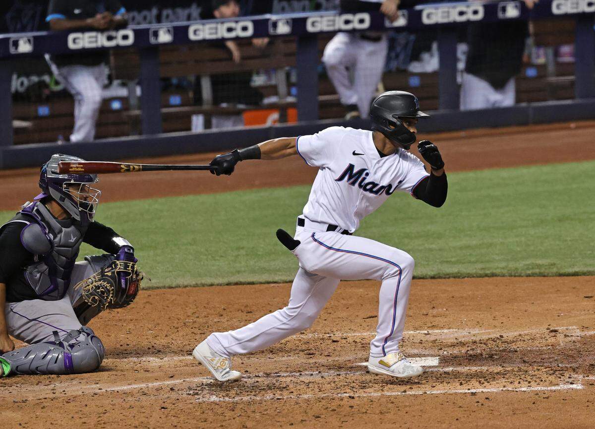 Miami Marlins pinch hitter Magneuris Sierra (34) grounds out during the fifth inning of their baseball game against the Colorado Rockies at loanDepot park on Wednesday, June 9, 2021 in Miami, Florida.