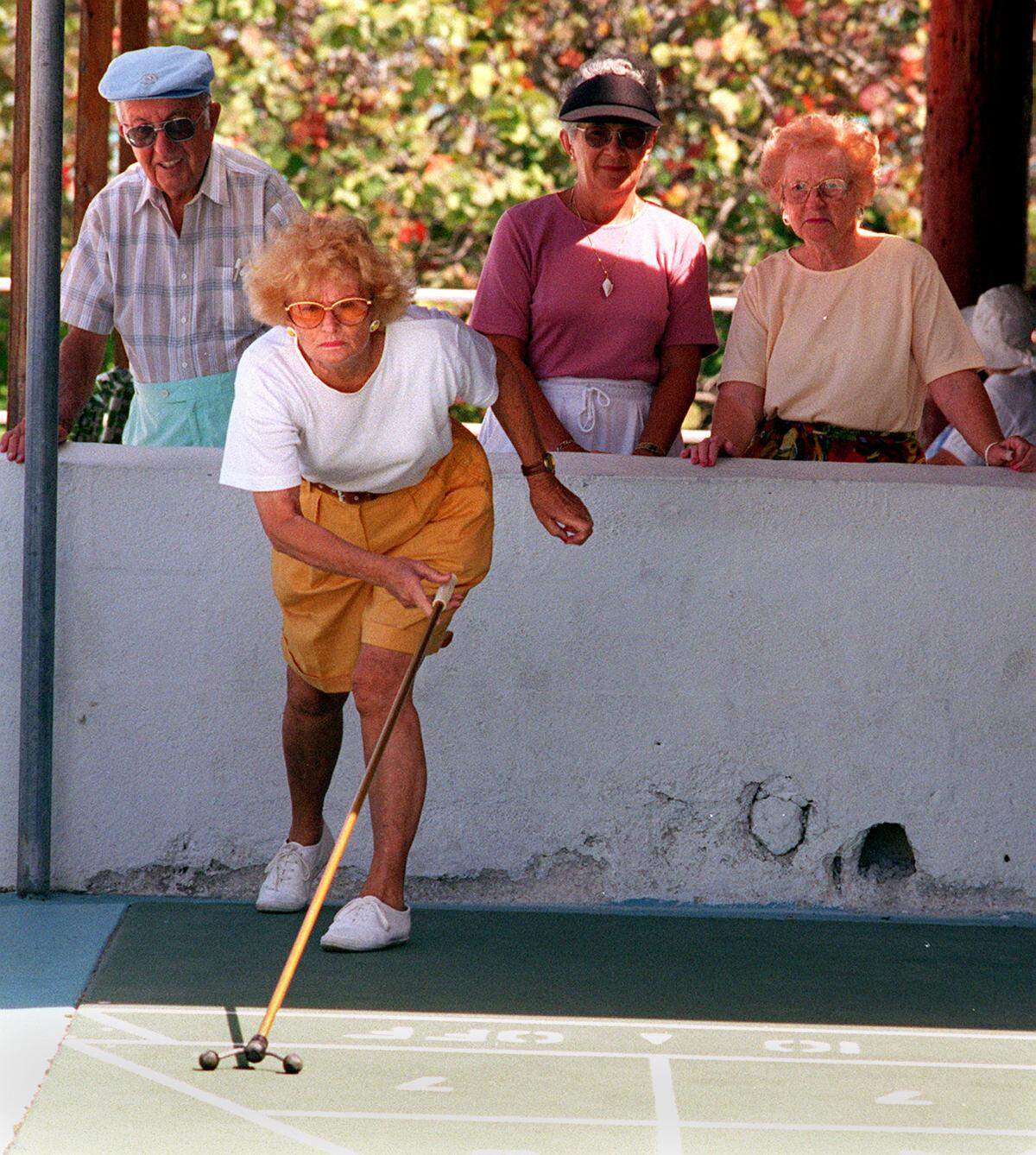 Lucienne Roy, from Canada plays in a shuffleboard tournament in 1995 at the Surfside Community Center where they are sponsoring a Salute to Canada week to thank them for their patronage.