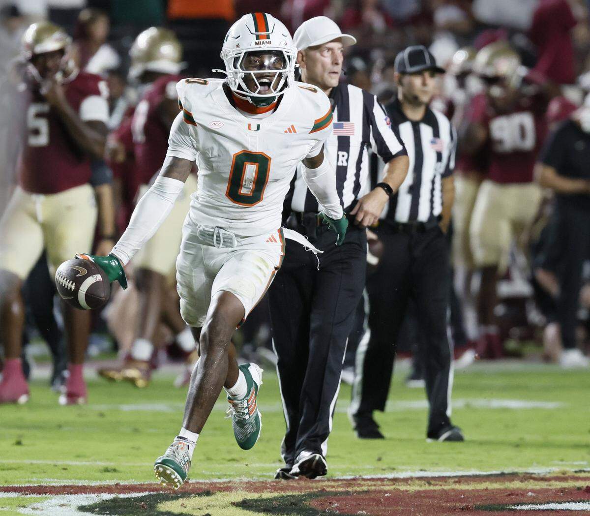 Miami Hurricanes defensive back Keionte Scott (0) recovers a fumble in the first half against the Florida State Seminoles at Doak Campbell Stadium in Tallahassee, Florida, on Saturday, October 4, 2025.