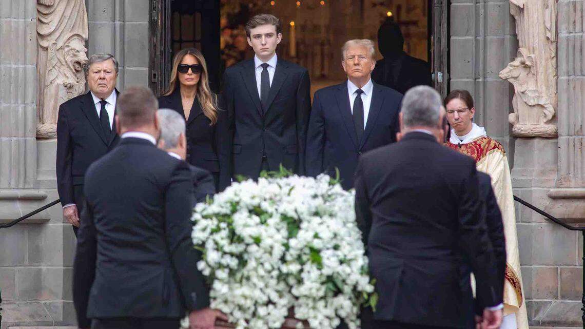 Viktor Knavs (from left), Melania Trump, Barron Trump, former President Donald Trump and Bethesda-by-the-Sea Rector the Rev. Tim Schenck watch as the the casket of Amalija Knavs is brought into the church on Thursday.