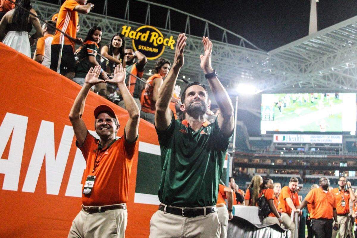 Manny Diaz Sr and Manny Diaz Jr showing their University of Miami pride.