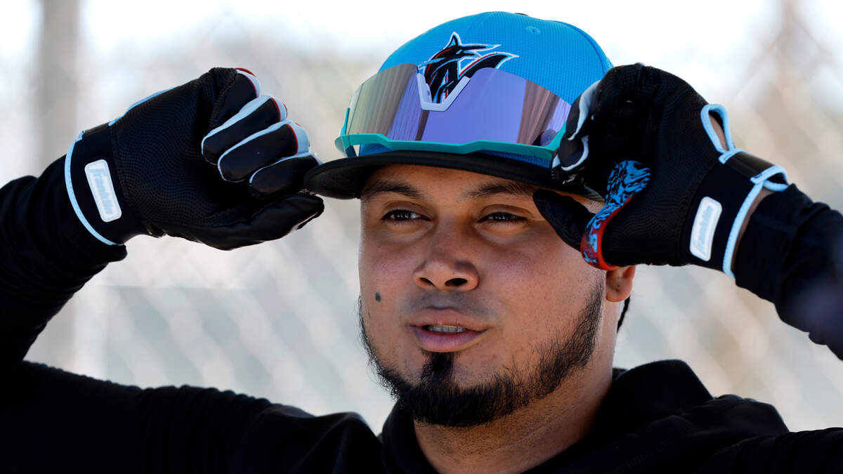 Miami Marlins second baseman Luis Arraez adjusts his hat during Miami Marlins spring training at Roger Dean Chevrolet Stadium in Jupiter, Florida on Tuesday, February 20, 2024.