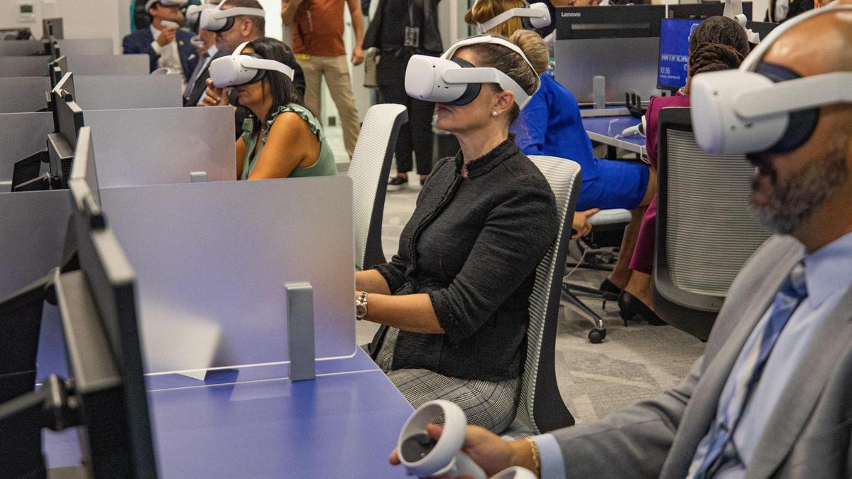 People watch a live demonstration of a virtual reality class Sept. 20, 2022, at the Artificial Intelligence Center on Miami Dade College’s North Campus.