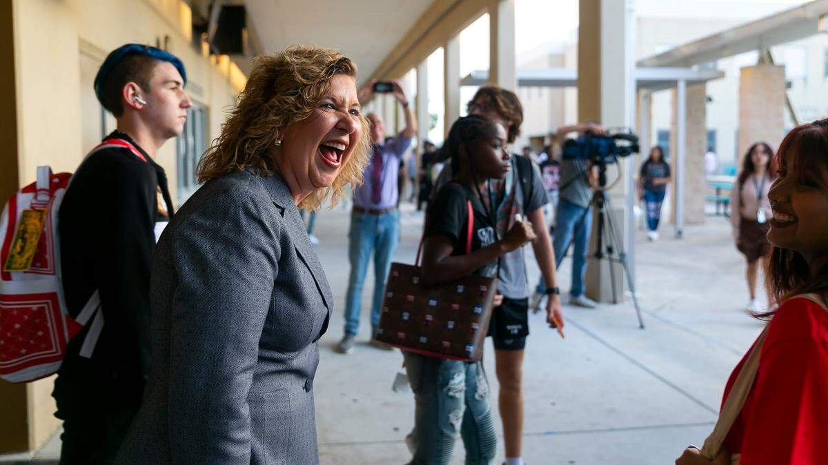 Broward County School Superintendent Dr. Vickie L. Cartwright greets students as they arrive for the first day of school at Coral Glades High School on Tuesday, Aug. 16, 2022 in Coral Springs, Fla.