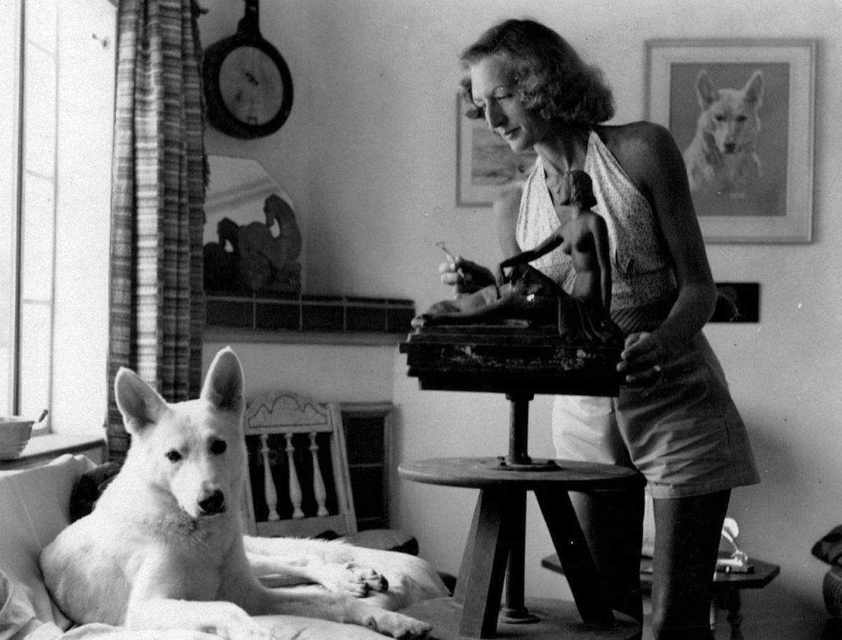 Sculptor Eileen Parnell works in her studio on Normandy Isle.