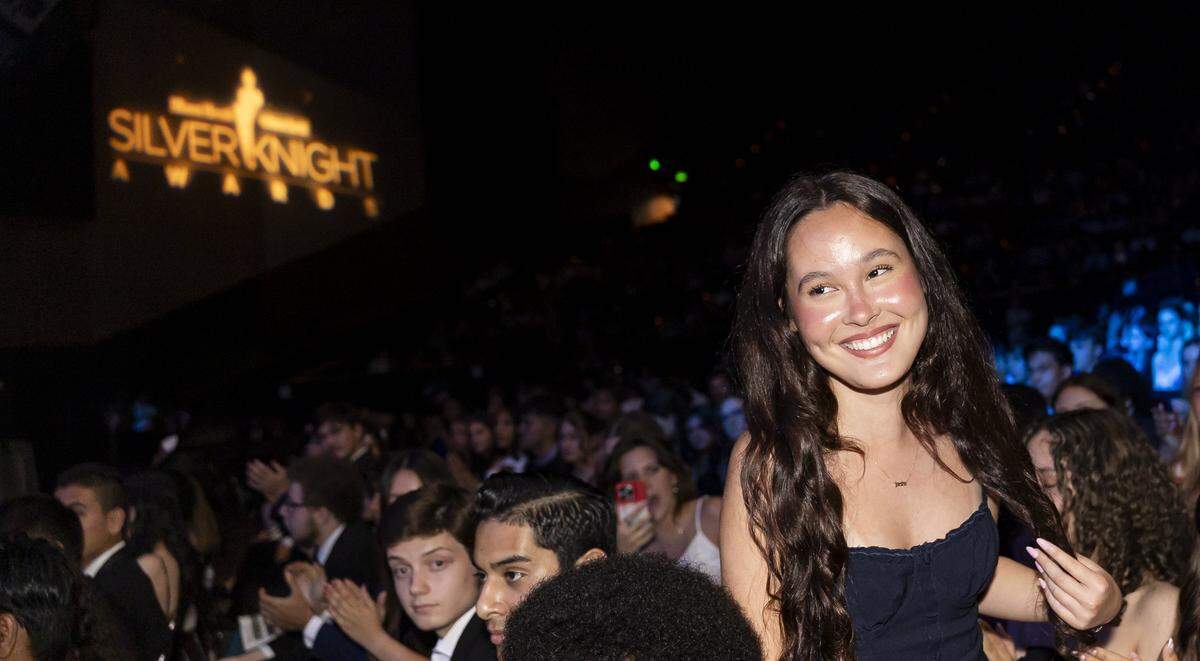 Silver Knight winner Jade Capella, from American Heritage Schools, walks to the stage after winning in the Speech category.