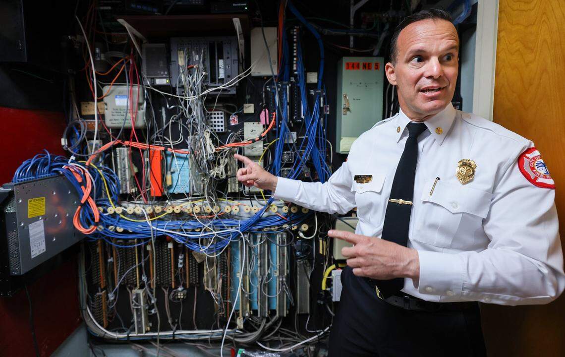 The City of Miami Fire Chief Robert Hevia points to an outdated electric closet that contains important communication and other devices that are essential for public safety at Fire Station 1, built in 1964, where mold, water intrusion, and outdated equipment are hampering effective emergency response and community safety during a press tour with the mayor and other officials. Miami Mayor Eileen Higgins toured the city's police and fire facilities in Miami, Florida on Monday, April 20, 2026. Higgins is proposing a general obligation bond to fund critical repairs and upgrades to aging public safety buildings, citing concerns over deteriorating conditions that threaten effective emergency response and community safety.