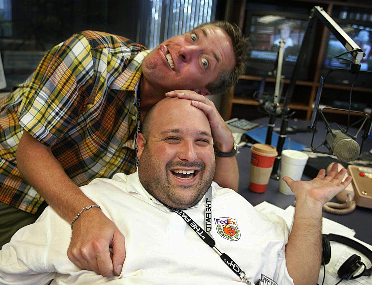 In this file photo from Sept. 4, 2003, Scott Ferrall, host of WQAM’s “The Scott Ferrall Show” mugs the camera with his sidekick, Brian “The Beast” London, during a break in the show.
