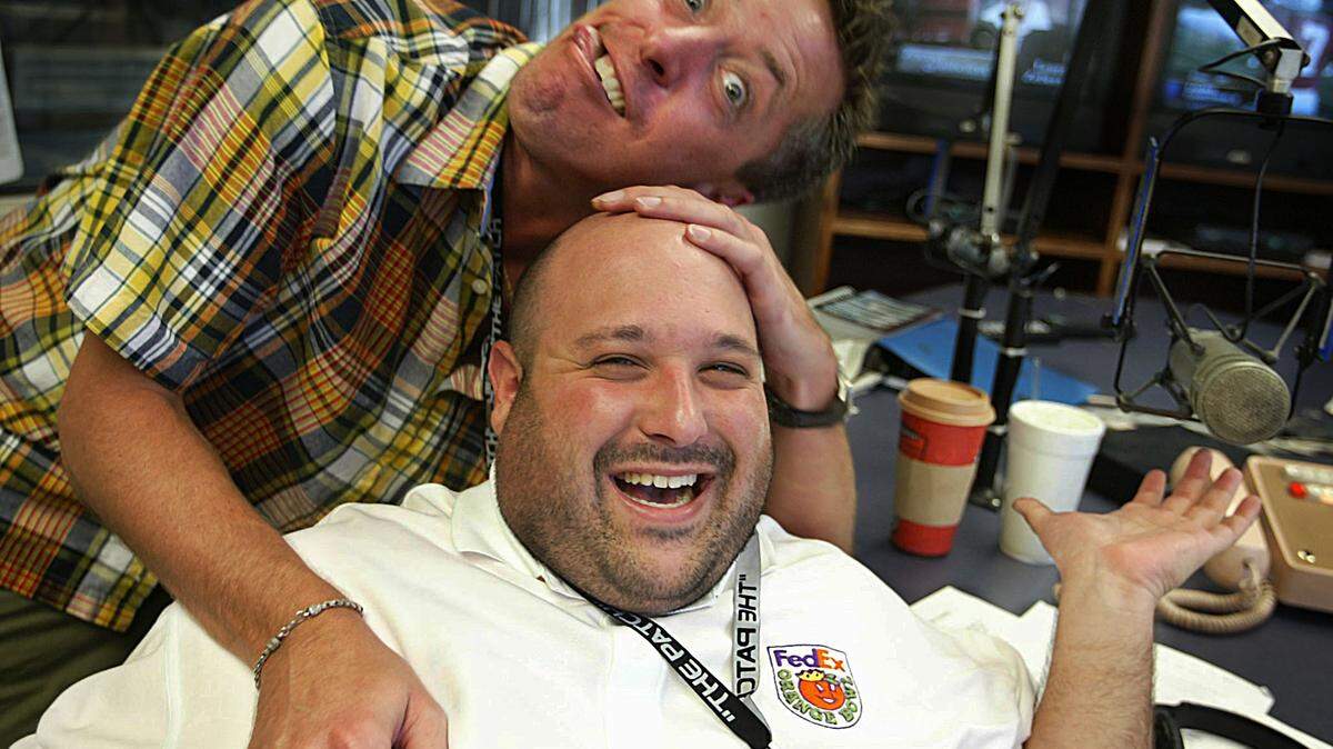 In this file photo from Sept. 4, 2003, Scott Ferrall, host of WQAM’s “The Scott Ferrall Show” mugs the camera with his sidekick, Brian “The Beast” London, during a break in the show.