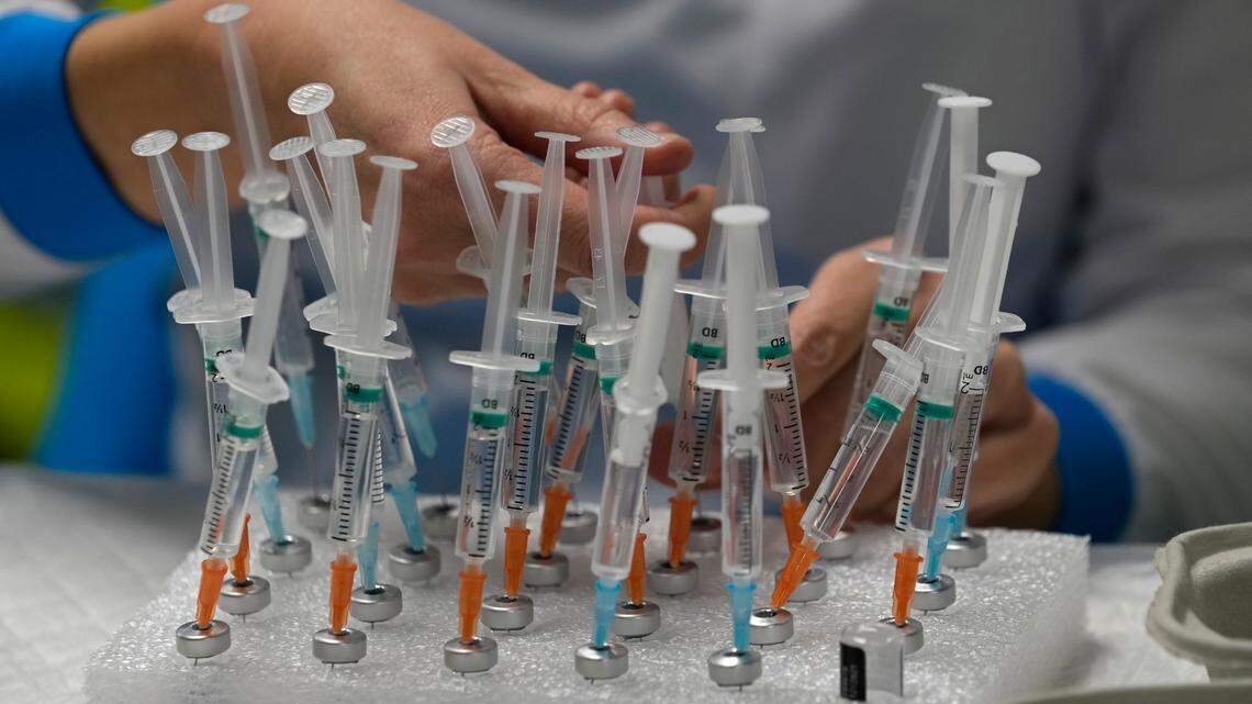 A nurse prepares vaccines in the Wizink Center, currently used for COVID-19 vaccinations in Madrid, Spain, on Dec. 1, 2021.