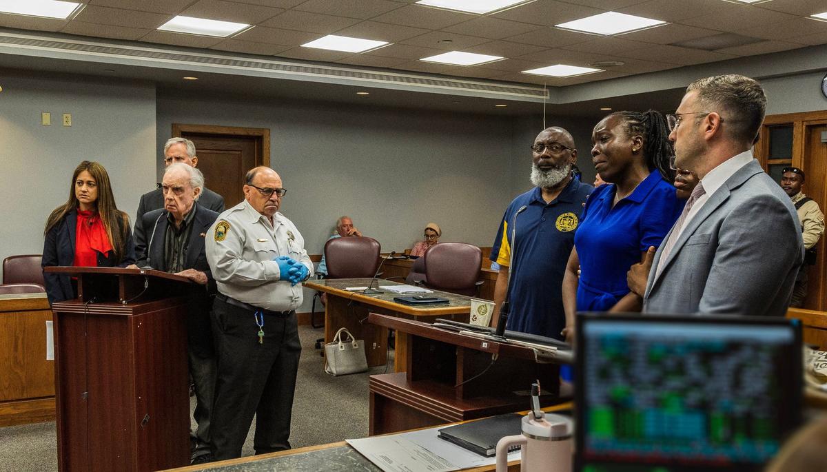 Child abuse survivor Keisha Etienne, her attorneys and family members listen as Miami-Dade Circuit Court Judge Alberto Milian approves Albert Bassett’s plea deal. As part of the plea deal, Bassett pleaded guilty to four counts of aggravated child abuse, but does not have to register as a sex offender.