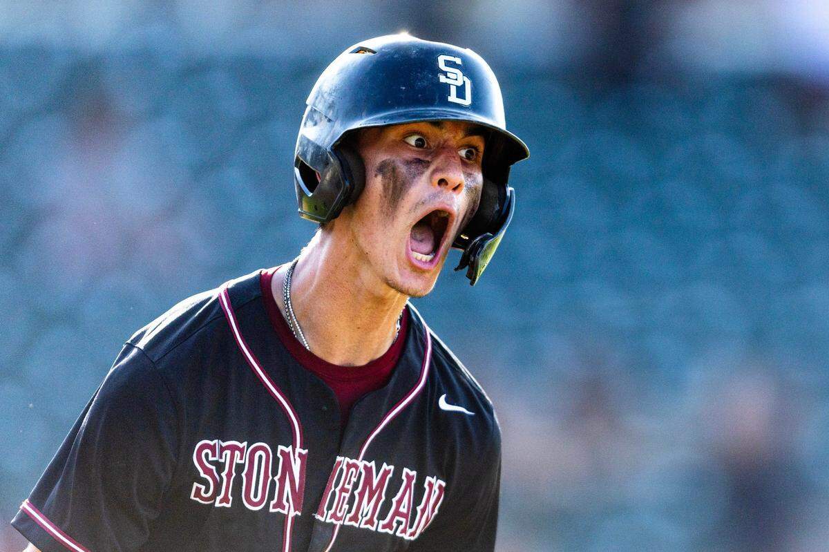 Marjory Stoneman Douglas base runner Nick Diaz (11) reacts to hitting a home run during the Class 7A semifinal state game against Vero Beach at Hammond Stadium on Friday, May 17, 2024, in Fort Myers, Fla.